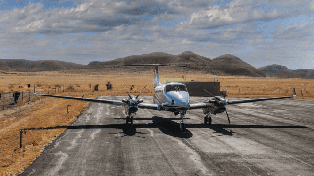Mountainview airstrip with plane on runway