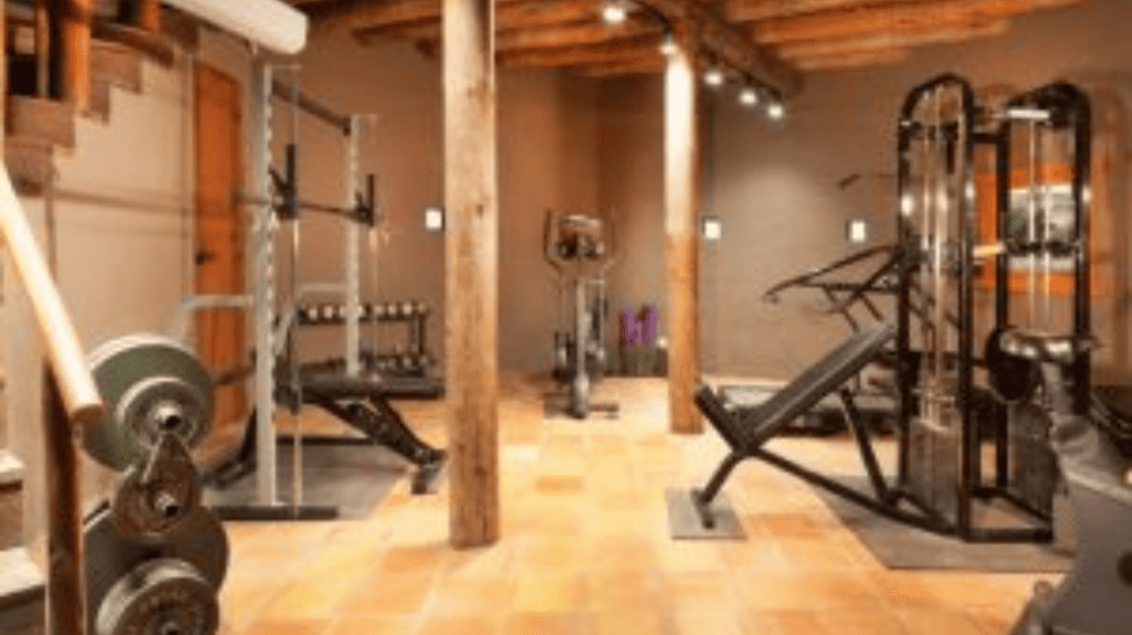 wood floor gym with weight equipment